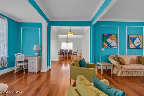 a living room with furniture and a lamp