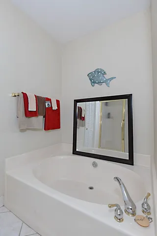 a bathroom with a bathtub and a sink