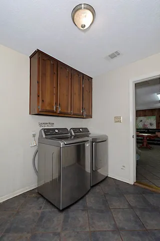a stove top oven sitting inside of a kitchen