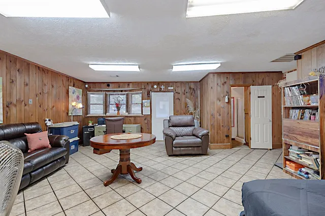 a living room with furniture and a rug