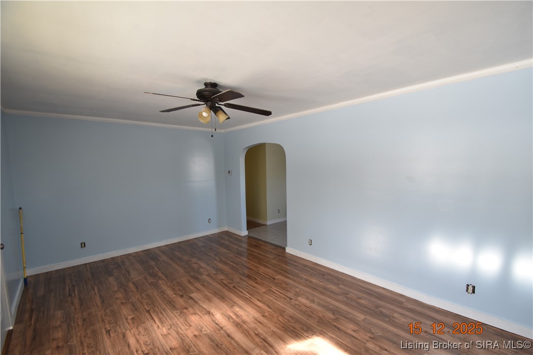 10204 Dalby Road Georgetown, IN 47122 - Photo 2 of 27 Living Room with wood laminate floor and ceiling fan. Crown molding.