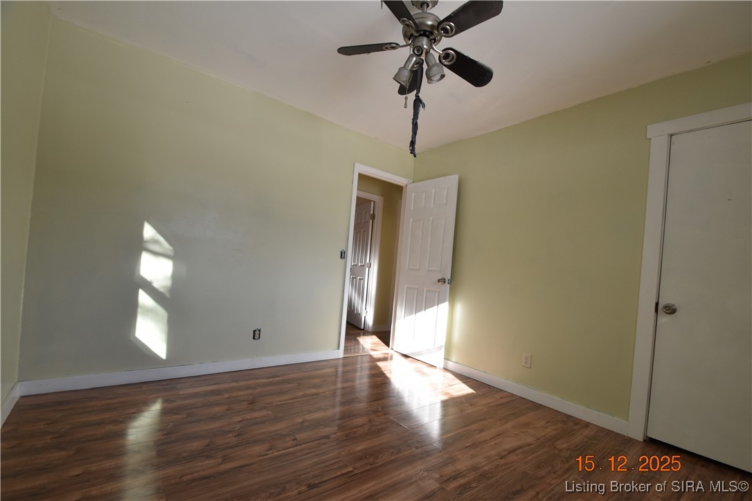 10204 Dalby Road Georgetown, IN 47122 - Photo 7 of 27 Bedroom #1 with laminate floors & a fan.