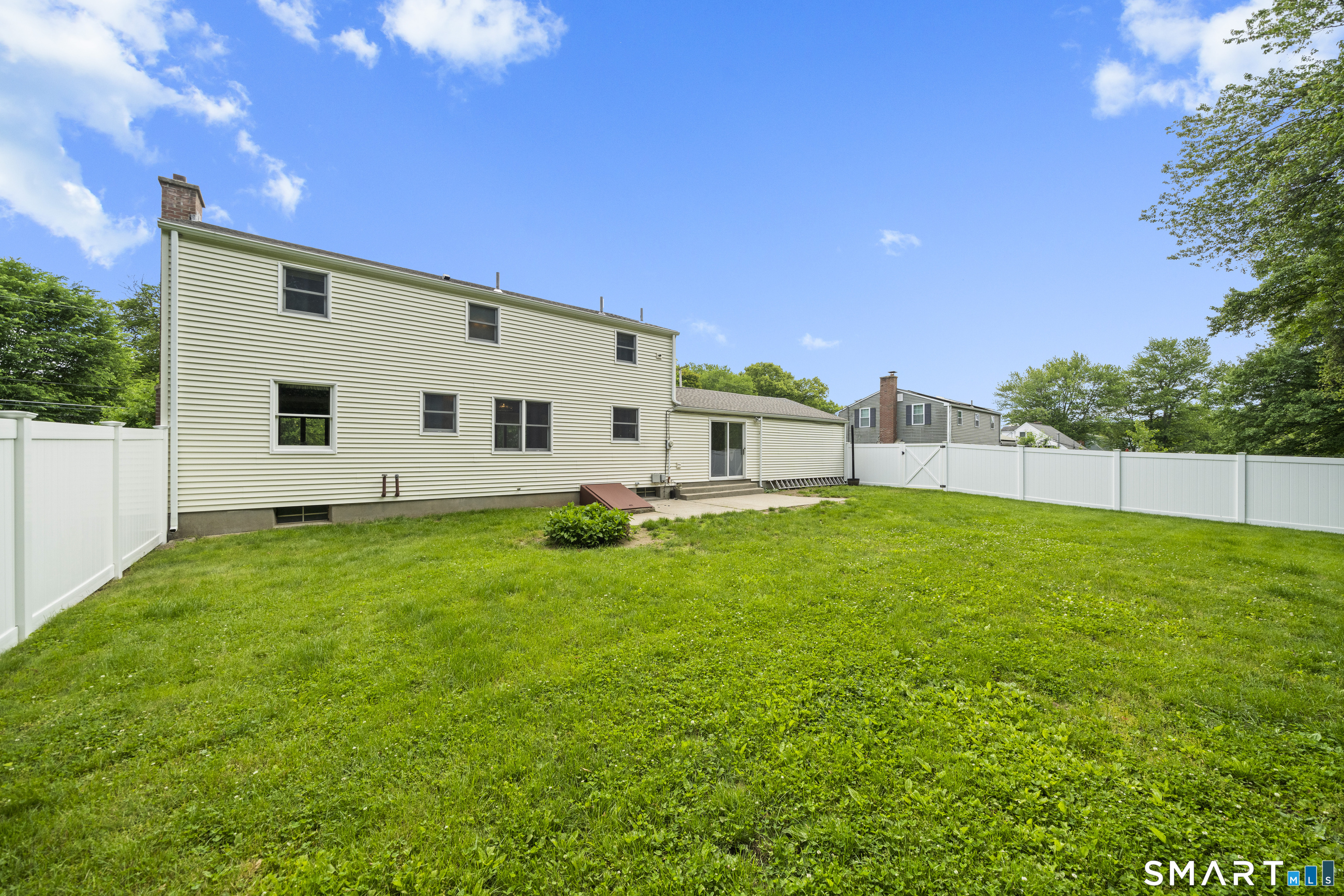 6 Cartier Road Enfield, CT 06082 - Photo 37 of 40 a view of a white house with a big yard