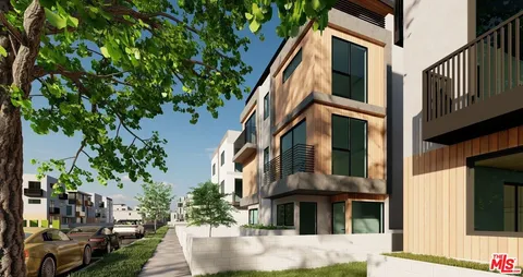 a view of a building with a tree