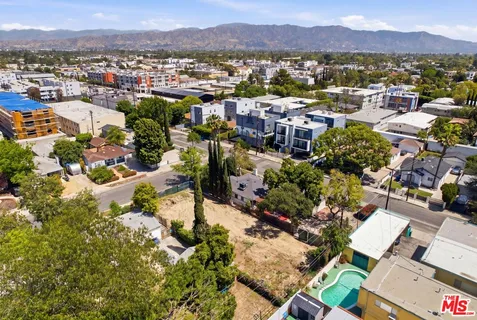 a view of a city with mountains in the background