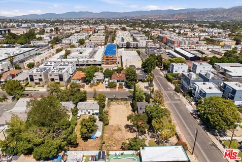 an aerial view of a city with lots of residential buildings