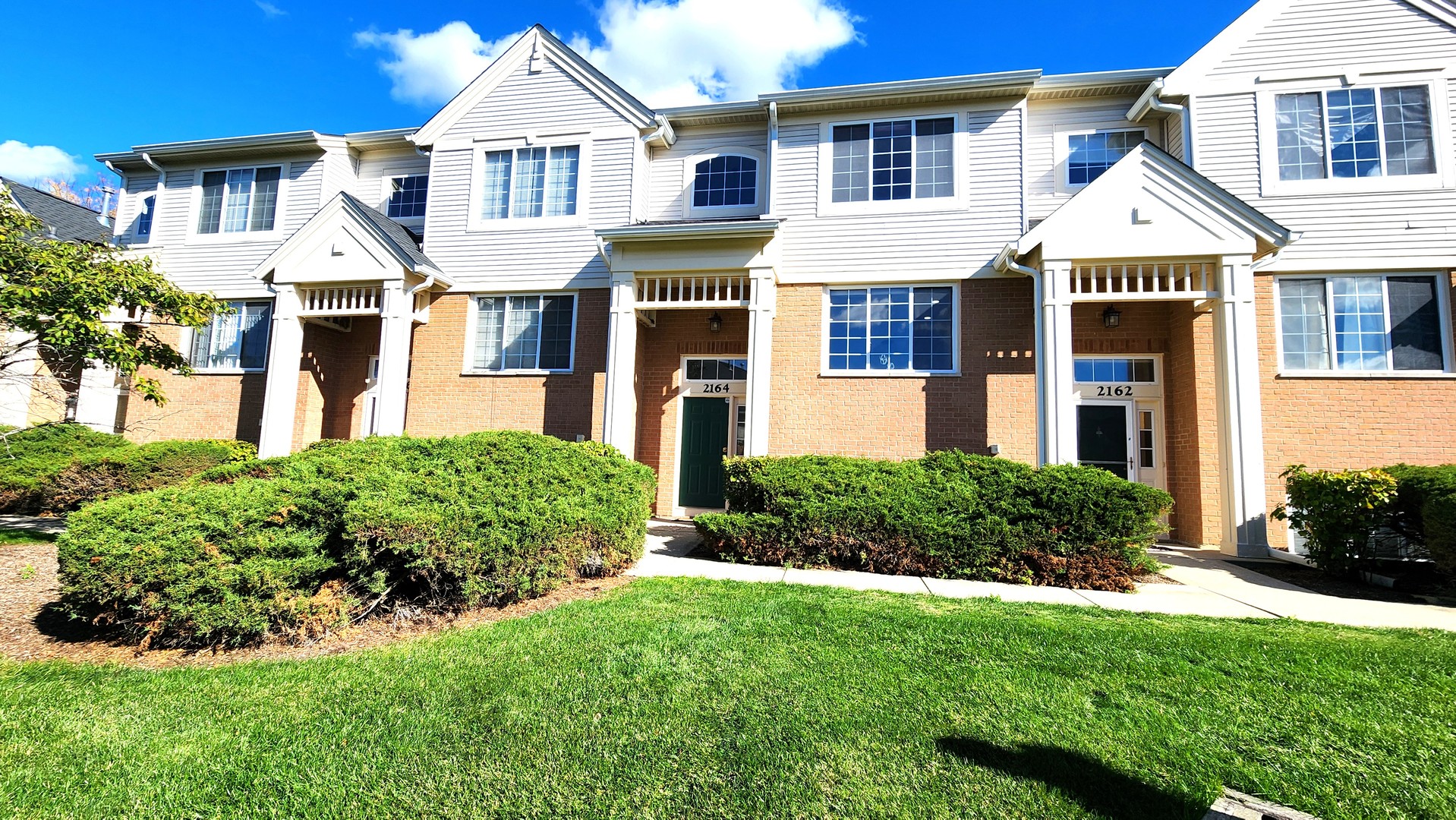 2164 West Concord Lane Addison, IL 60101 - Photo 1 of 21 a front view of a house with a yard