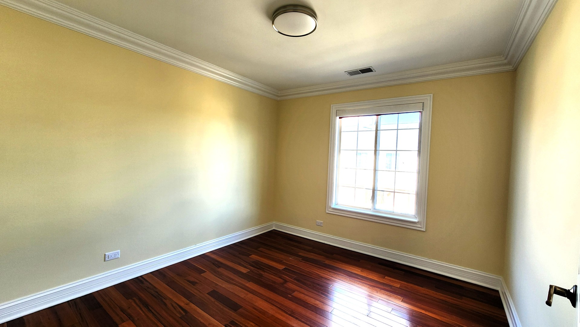 2164 West Concord Lane Addison, IL 60101 - Photo 15 of 21 a view of empty room with window and wooden floor