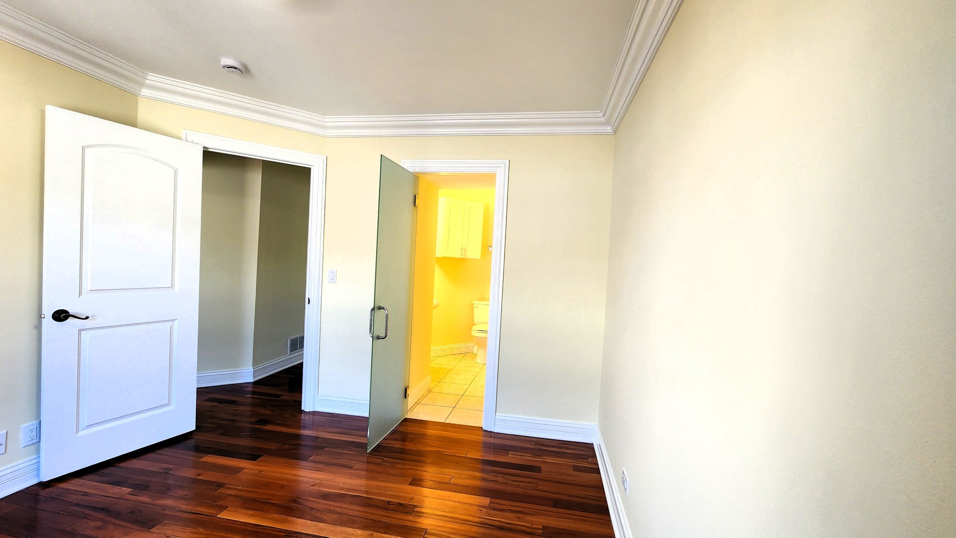 2164 West Concord Lane Addison, IL 60101 - Photo 16 of 21 a view of an empty room with wooden floor and a window