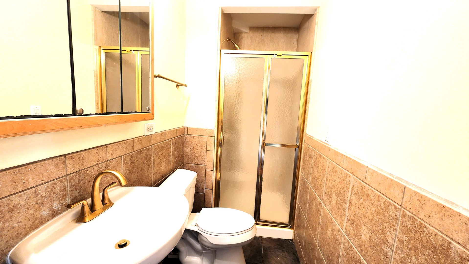 2164 West Concord Lane Addison, IL 60101 - Photo 20 of 21 a bathroom with a sink mirror vanity and toilet