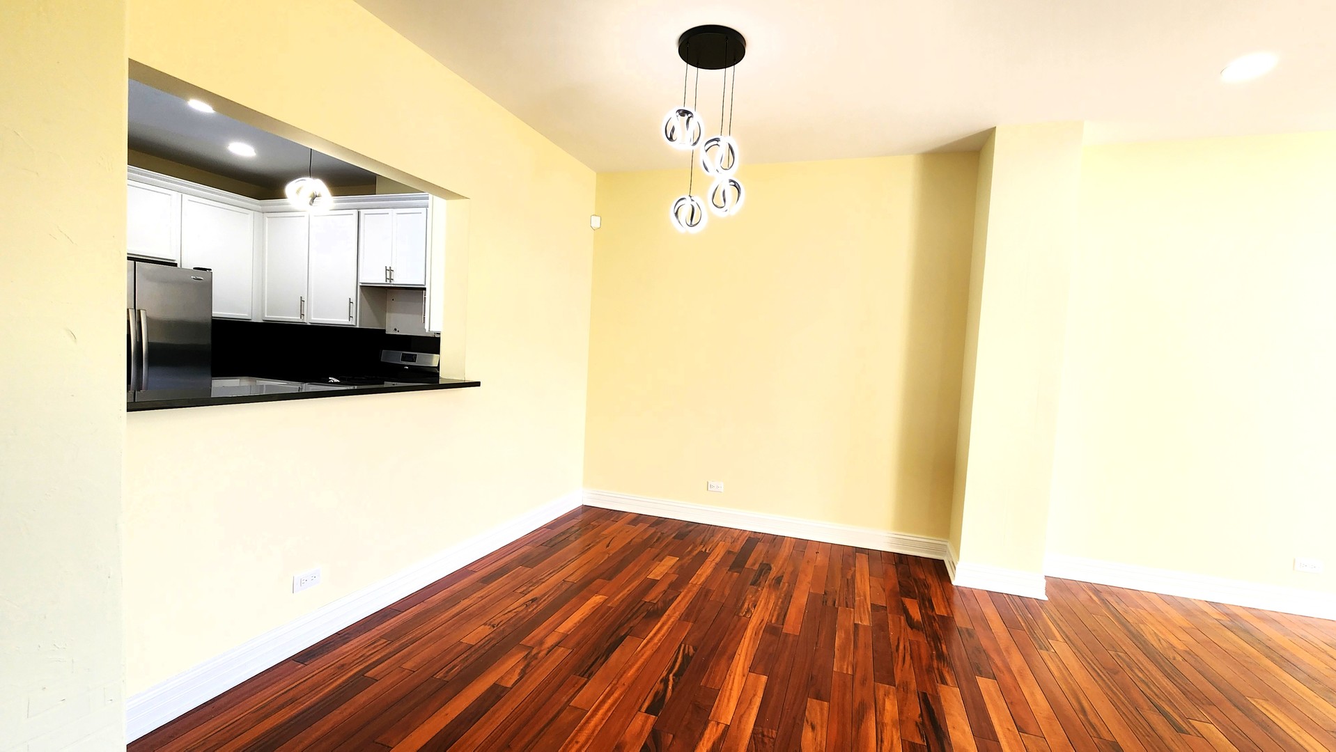 2164 West Concord Lane Addison, IL 60101 - Photo 5 of 21 a view of a hallway with wooden floor
