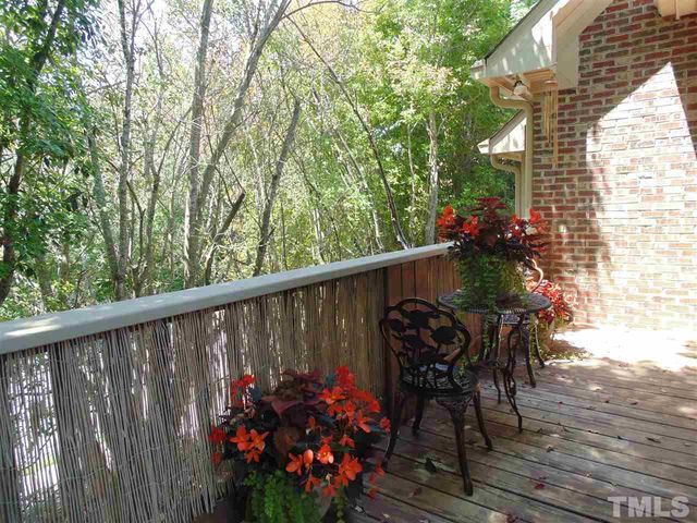 a view of a chairs and table in the balcony