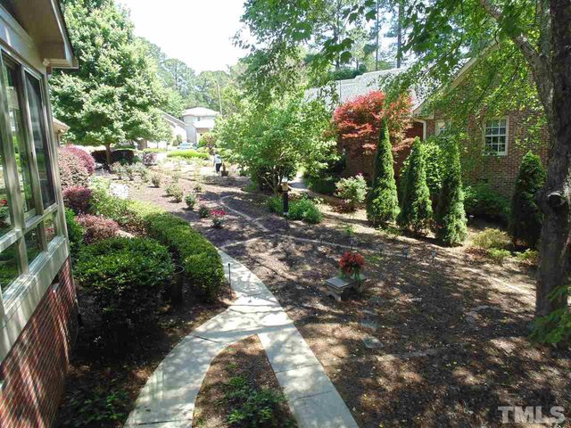a view of a street with lots of trees