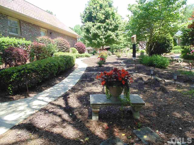 a view of a pathway with a fountain