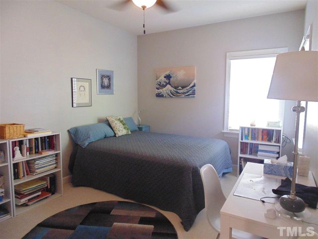 a bedroom with a bed furniture and a window