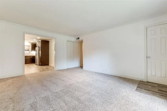 a kitchen with a sink stainless steel appliances and cabinets
