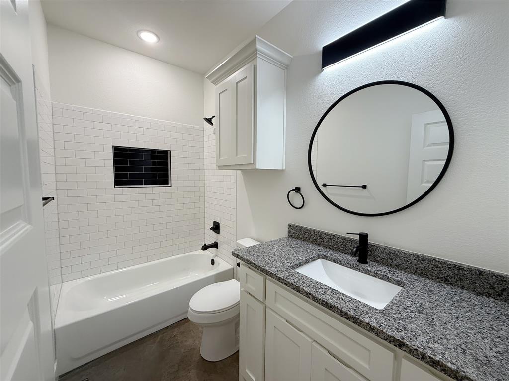1905 South Lamar Denison, TX 75021 - Photo 23 of 27 Bathroom featuring vanity and shower combination