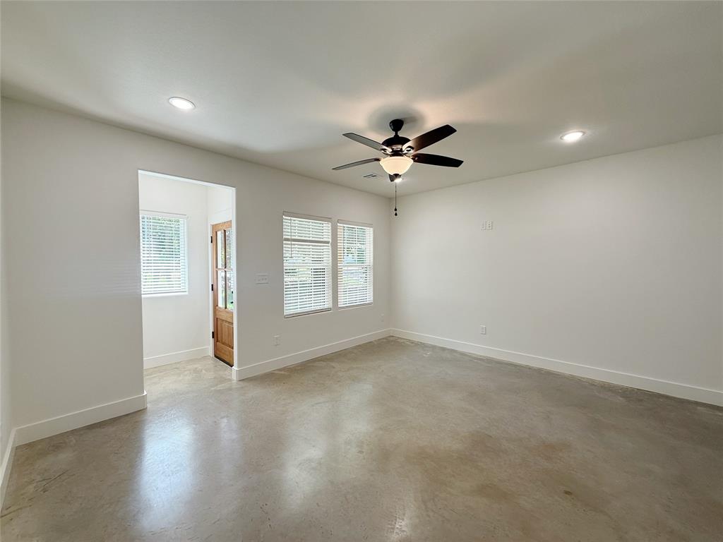 1905 South Lamar Denison, TX 75021 - Photo 4 of 27 Unfurnished room featuring finished concrete flooring, recessed lighting, and a ceiling fan
