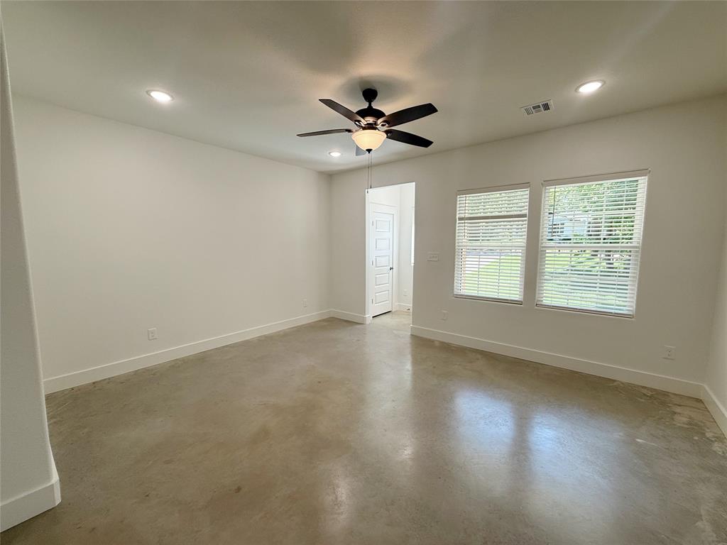 1905 South Lamar Denison, TX 75021 - Photo 5 of 27 Unfurnished room with concrete floors, recessed lighting, and a ceiling fan
