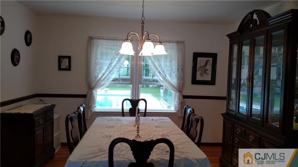 32 Harding Avenue Edison, NJ 08820 - Photo 4 of 25 a dining room with furniture and window