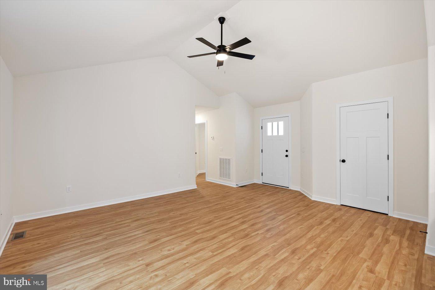 62 Rose Way Colonial Beach, VA 22443 - Photo 13 of 43 a view of a room with wooden floor and a ceiling fan