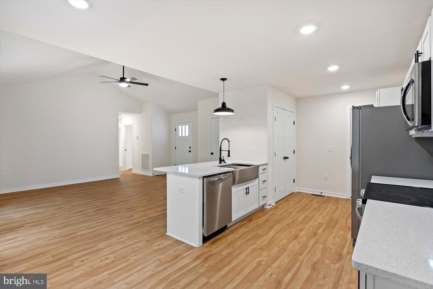 62 Rose Way Colonial Beach, VA 22443 - Photo 19 of 43 a kitchen with a sink and wooden floor