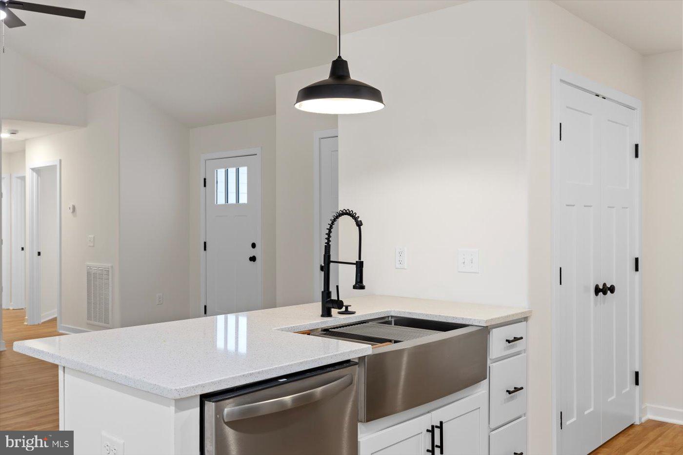62 Rose Way Colonial Beach, VA 22443 - Photo 20 of 43 a view of a kitchen counter space a sink and a stove