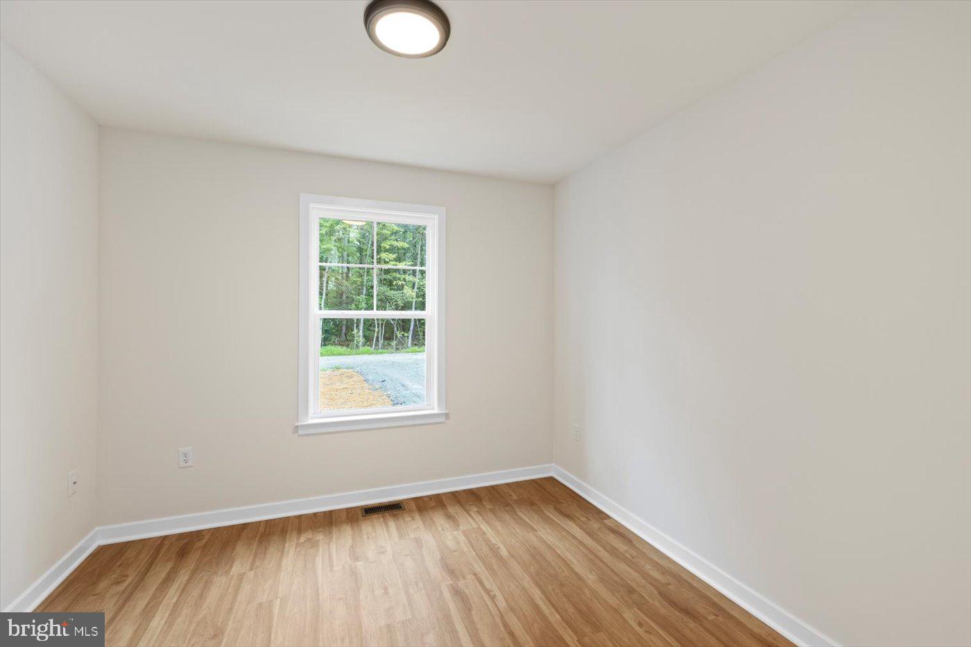 62 Rose Way Colonial Beach, VA 22443 - Photo 24 of 43 a view of a room with wooden floor and window