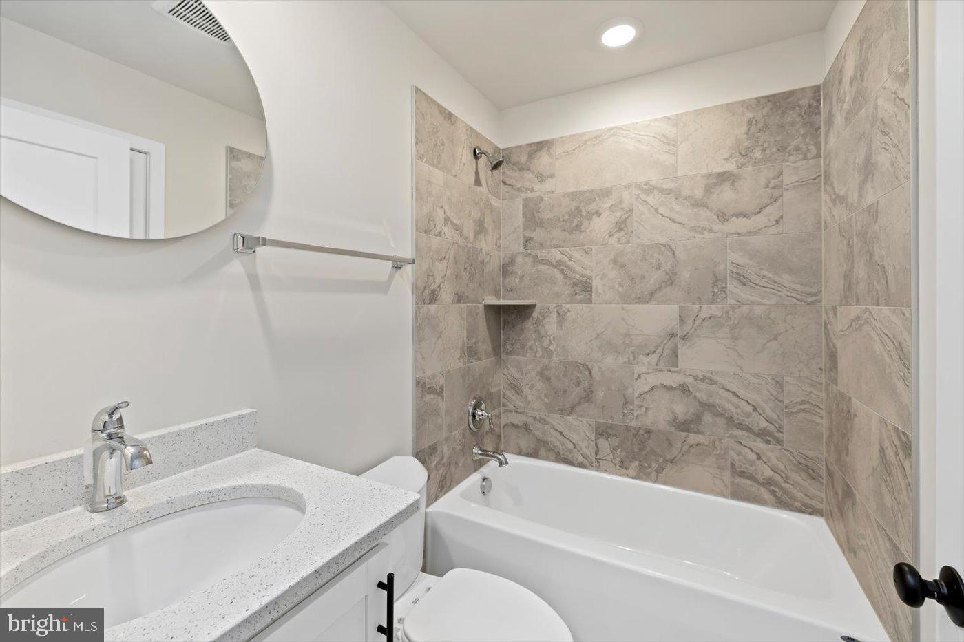 62 Rose Way Colonial Beach, VA 22443 - Photo 28 of 43 a bathroom with a granite countertop bathtub shower sink vanity and toilet