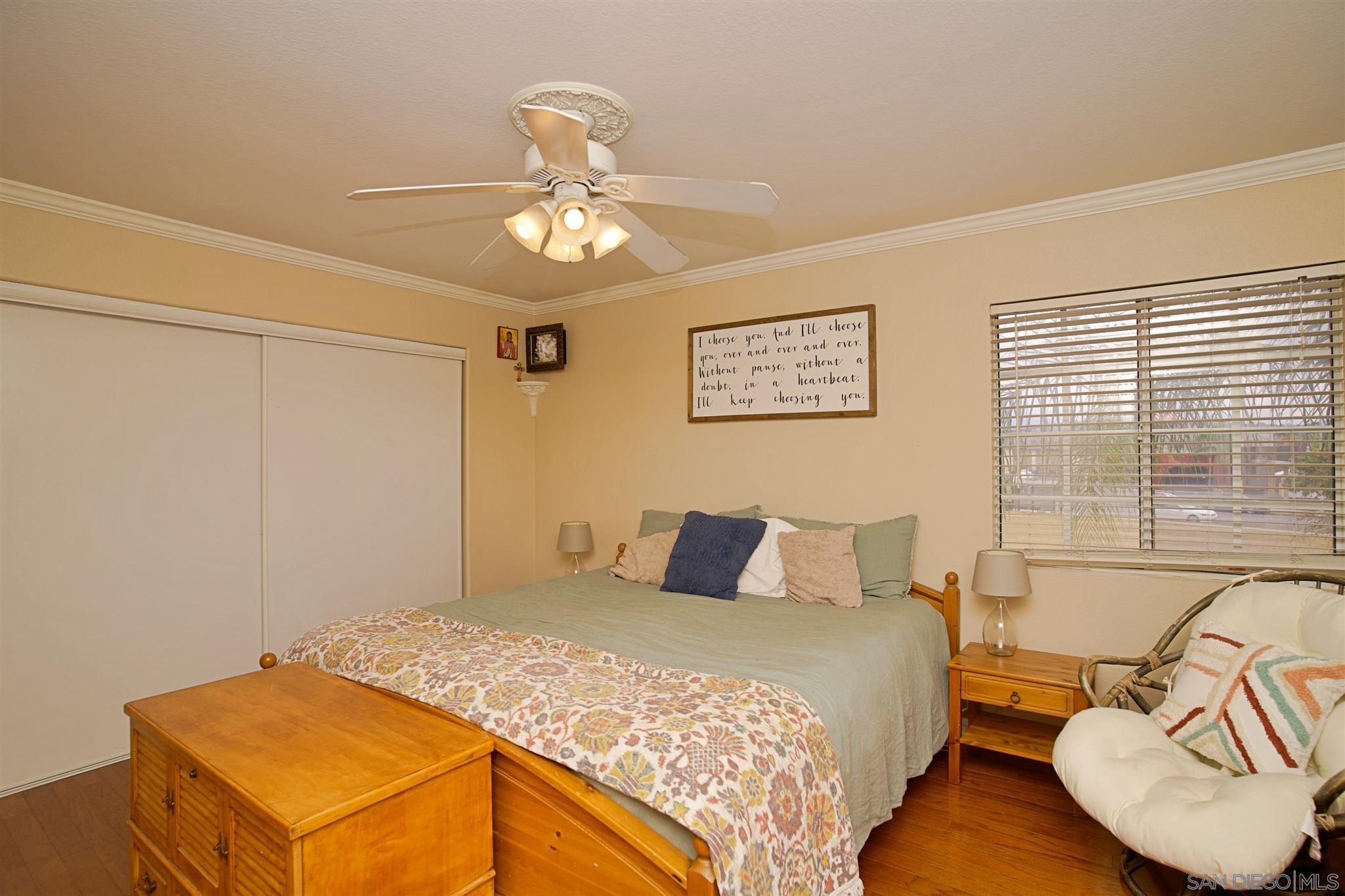 849 Friendly Circle El Cajon, CA 92021 - Photo 13 of 19 a bedroom with a bed and window