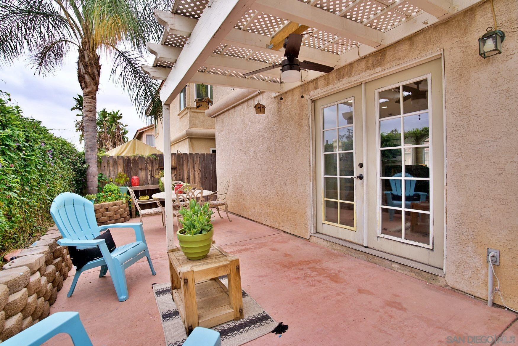 849 Friendly Circle El Cajon, CA 92021 - Photo 18 of 19 a view of a patio with a table and chairs and a barbeque