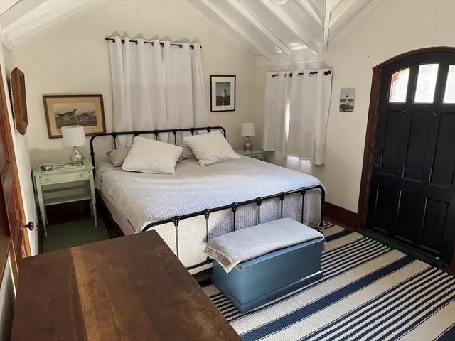 a bedroom with a bed and a walk in closet