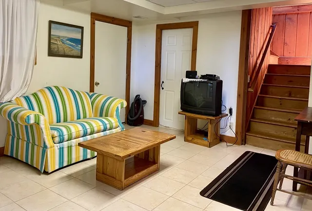 a living room with a couch and a flat screen tv