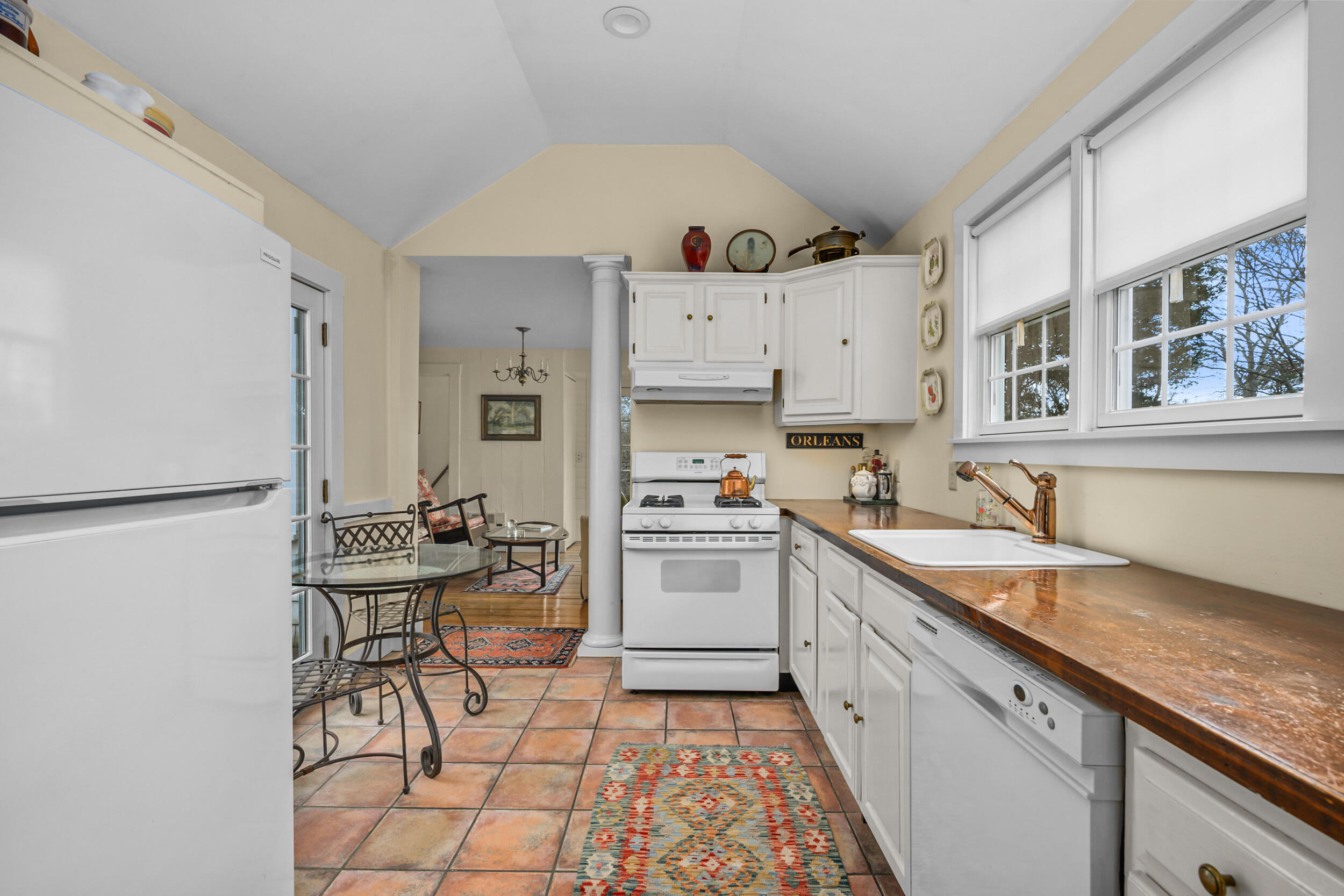 332 South Orleans Road Orleans, MA 02653 - Photo 13 of 42 a kitchen with stainless steel appliances granite countertop a stove a sink dishwasher and a refrigerator with wooden floor