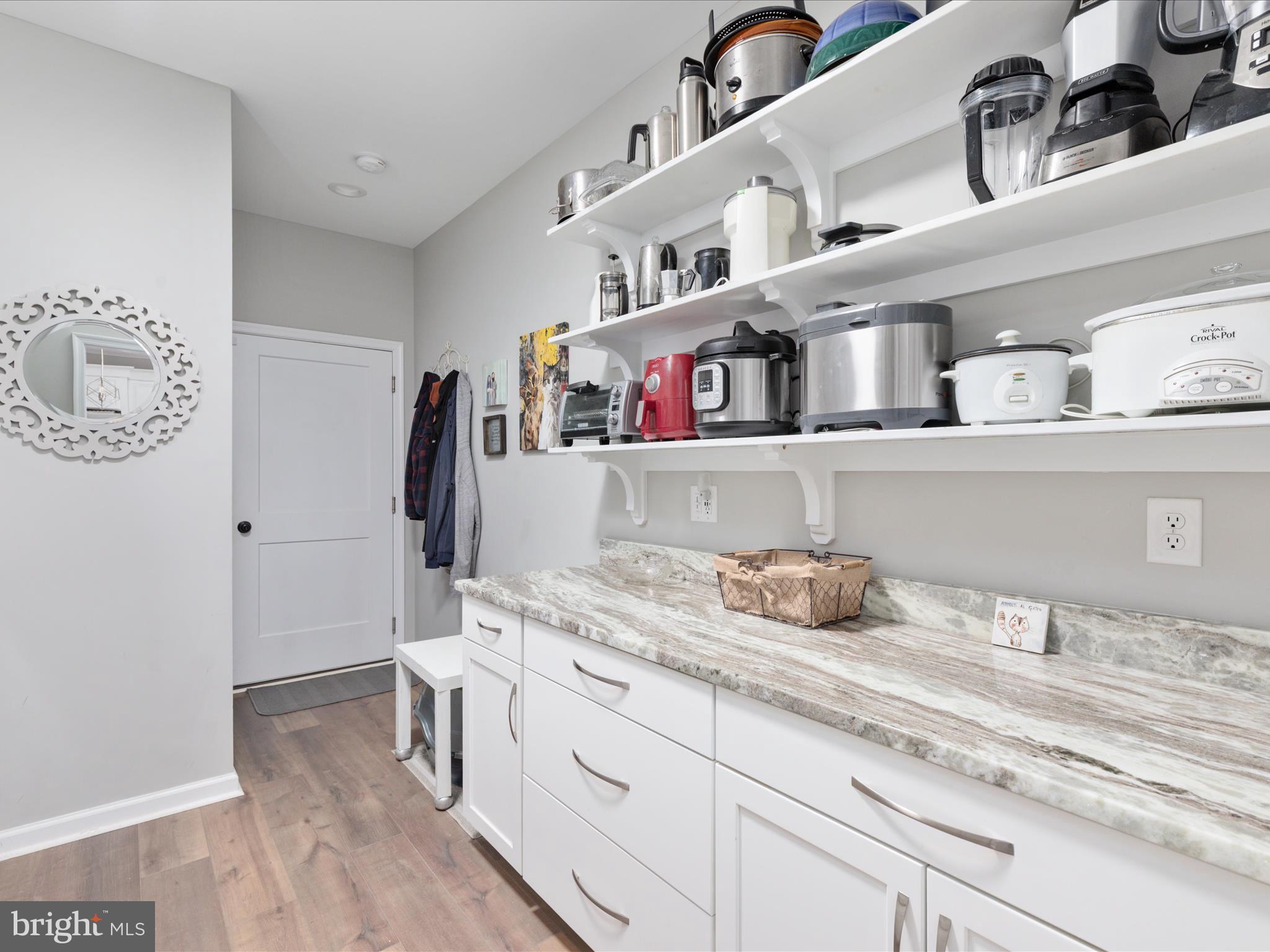 1857 Polk Road Edinburg, VA 22824 - Photo 17 of 55 a kitchen with a cabinets and window