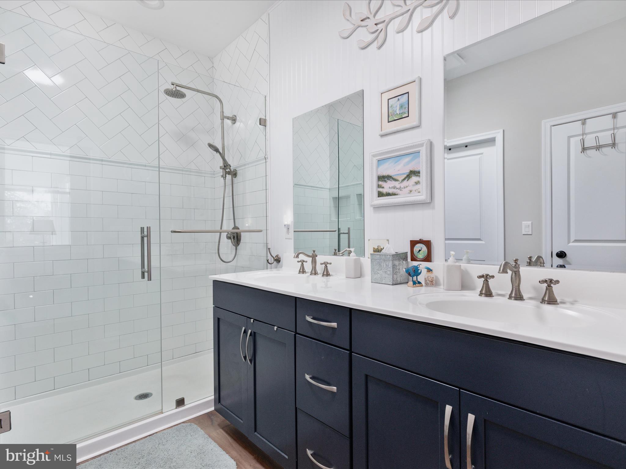 1857 Polk Road Edinburg, VA 22824 - Photo 22 of 55 a bathroom with double sink and a mirror
