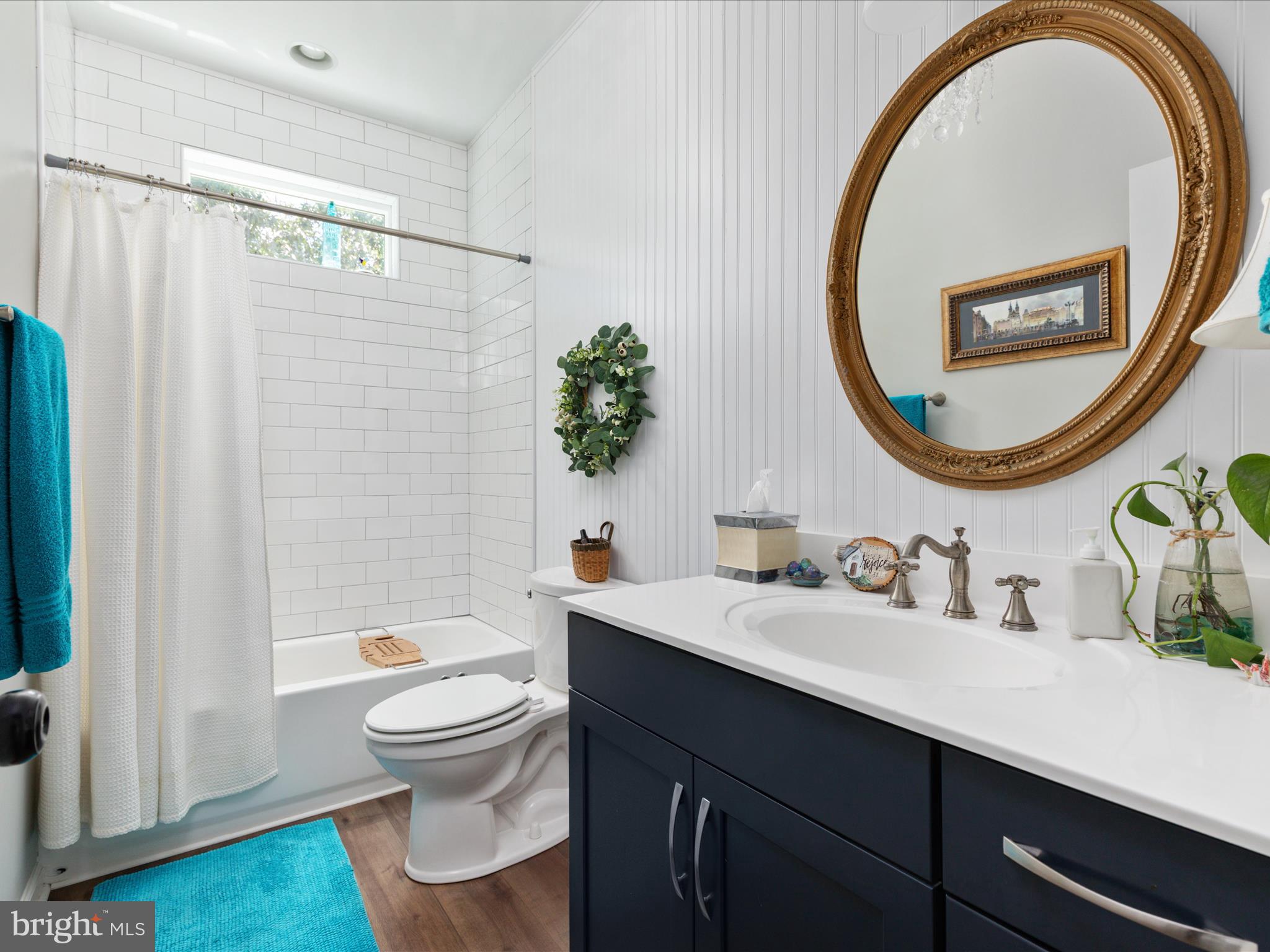 1857 Polk Road Edinburg, VA 22824 - Photo 24 of 55 a bathroom with a toilet a sink and a mirror