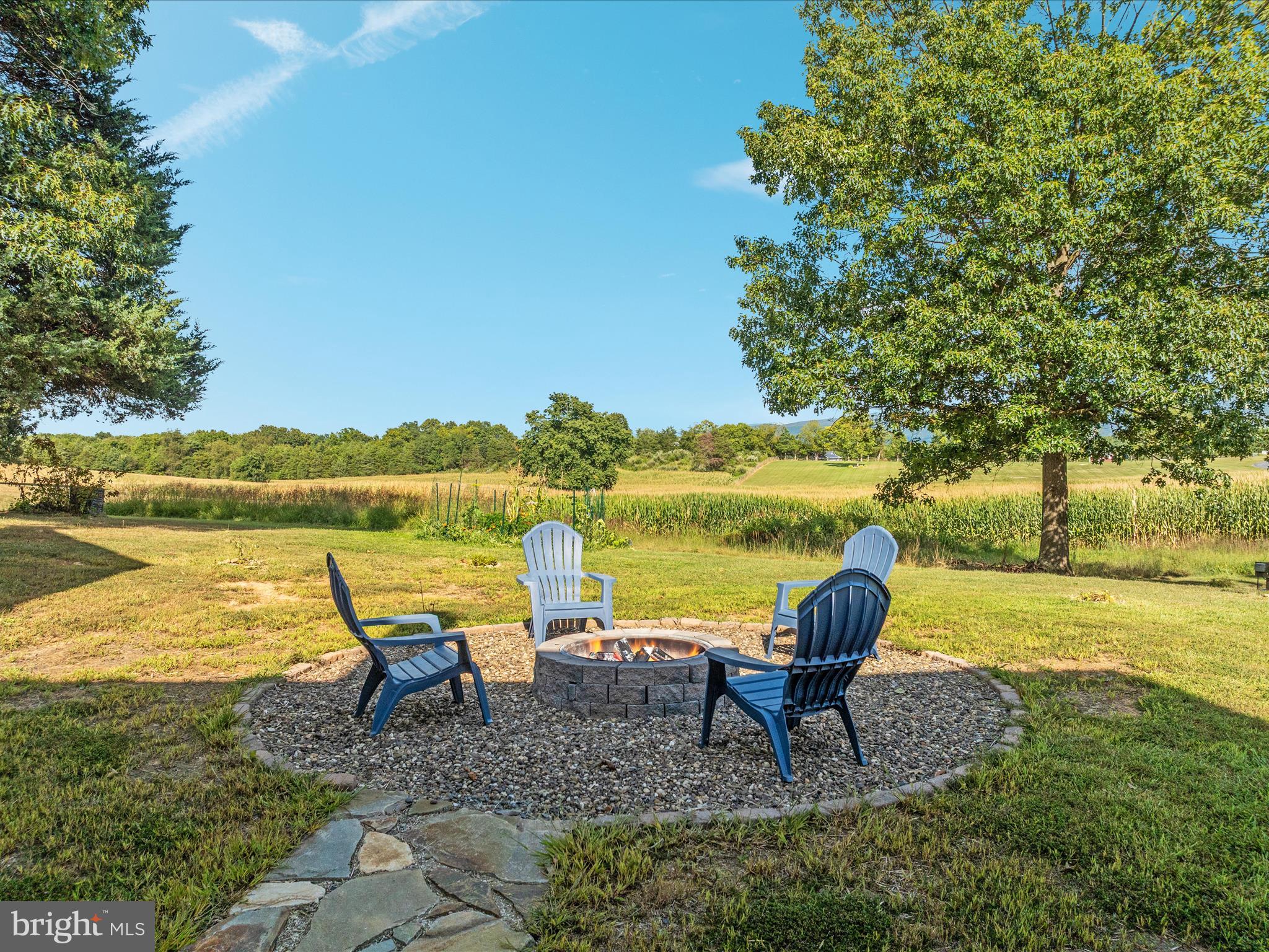 1857 Polk Road Edinburg, VA 22824 - Photo 33 of 55 a view of a lake with lawn chairs and a table