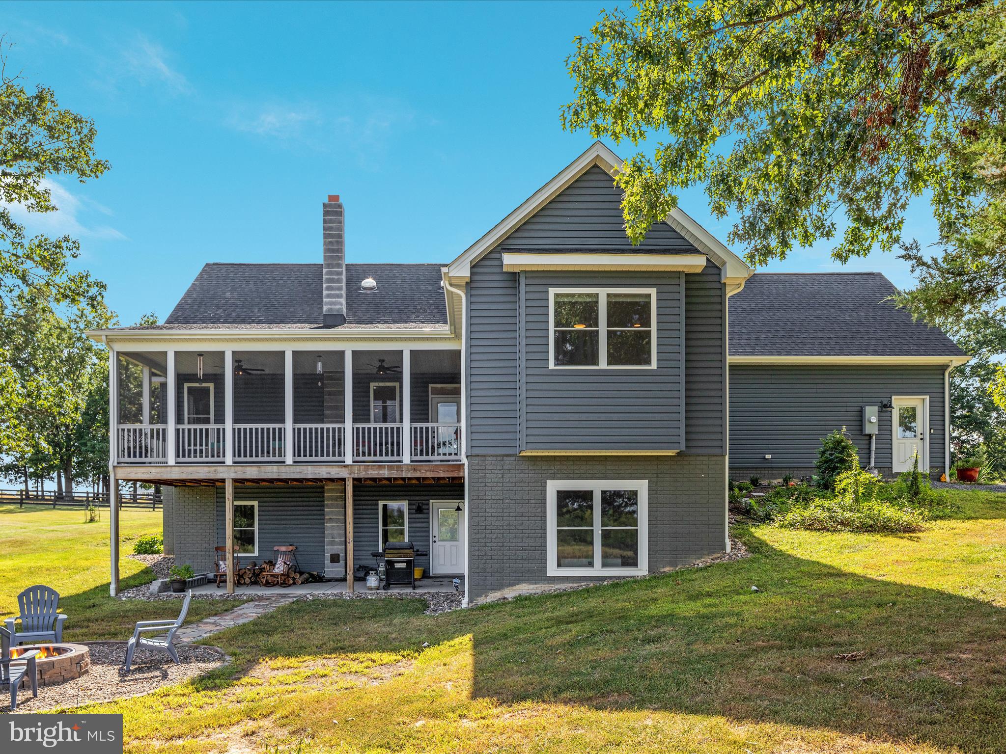 1857 Polk Road Edinburg, VA 22824 - Photo 4 of 55 a front view of a house with swimming pool having outdoor seating