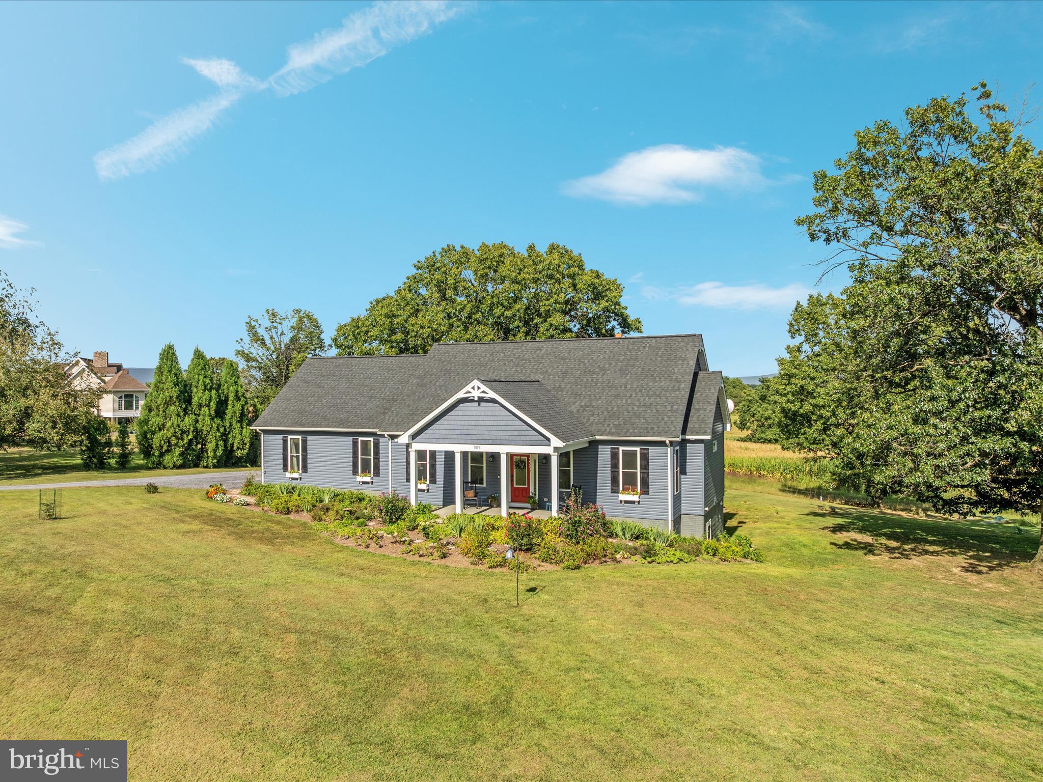 1857 Polk Road Edinburg, VA 22824 - Photo 42 of 55 a front view of a house with a yard