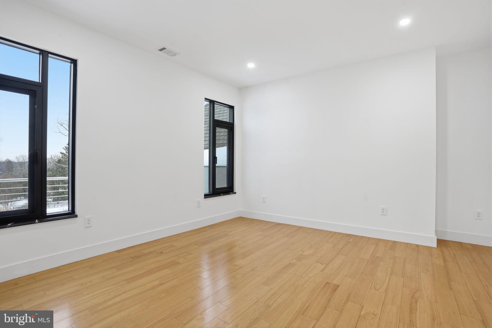 1047 Welsh Road Huntingdon Valley, PA 19006 - Photo 65 of 75 a view of empty room with wooden floor and fan