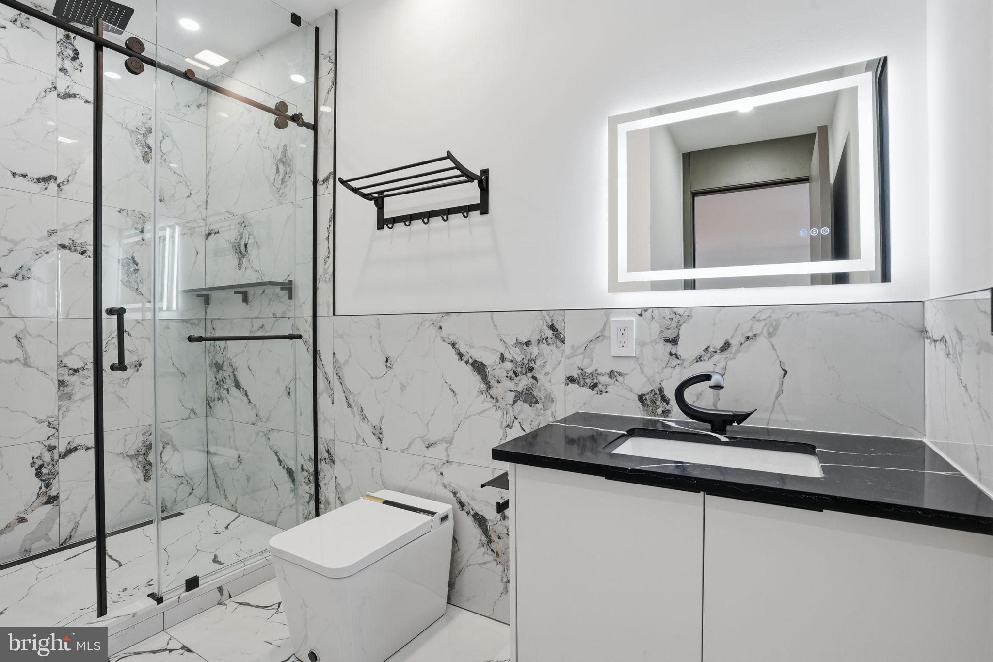 1047 Welsh Road Huntingdon Valley, PA 19006 - Photo 67 of 75 a bathroom with a sink toilet and shower
