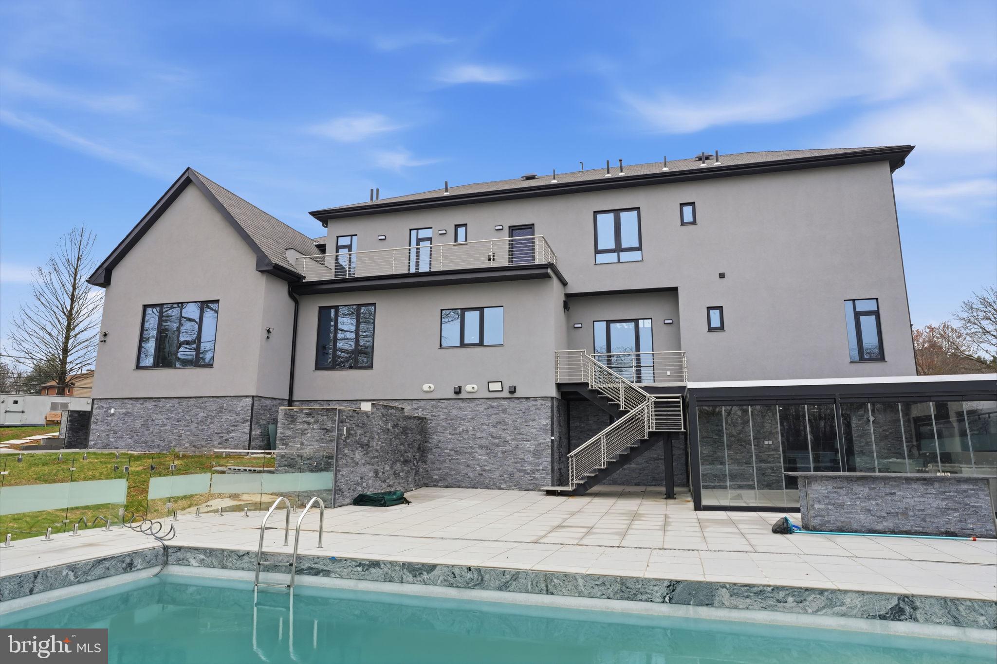 1047 Welsh Road Huntingdon Valley, PA 19006 - Photo 68 of 75 a view of a house with a swimming pool