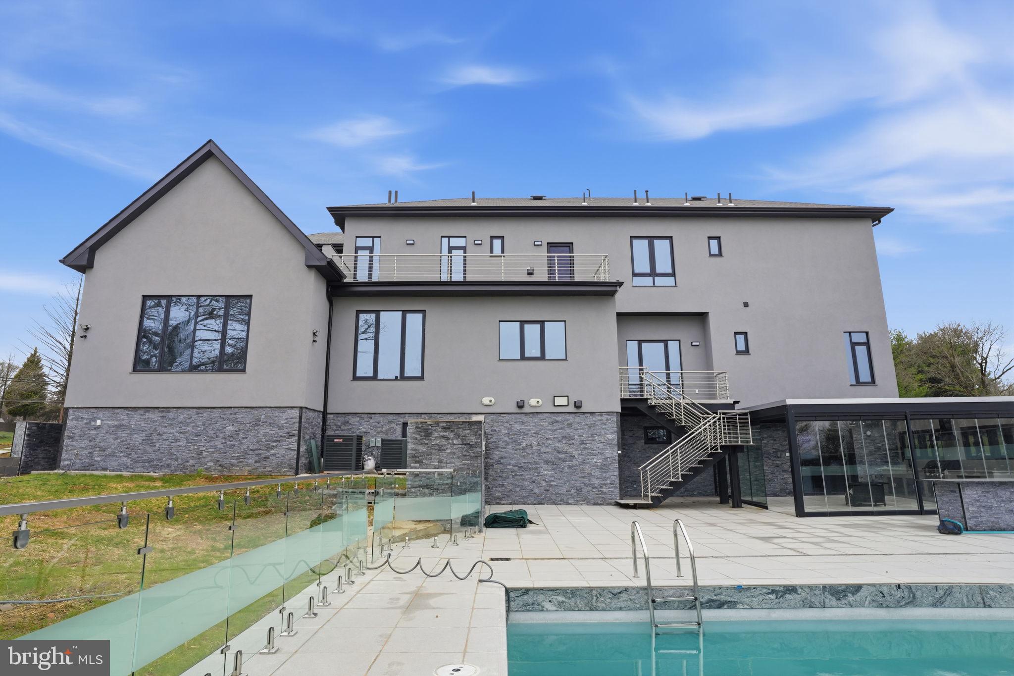 1047 Welsh Road Huntingdon Valley, PA 19006 - Photo 70 of 75 a view of a house with pool and chairs