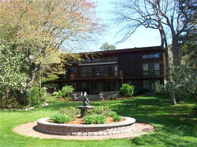 Undisclosed Address Centerville, MA 02632 - Photo 6 of 21 a front view of a house with a yard