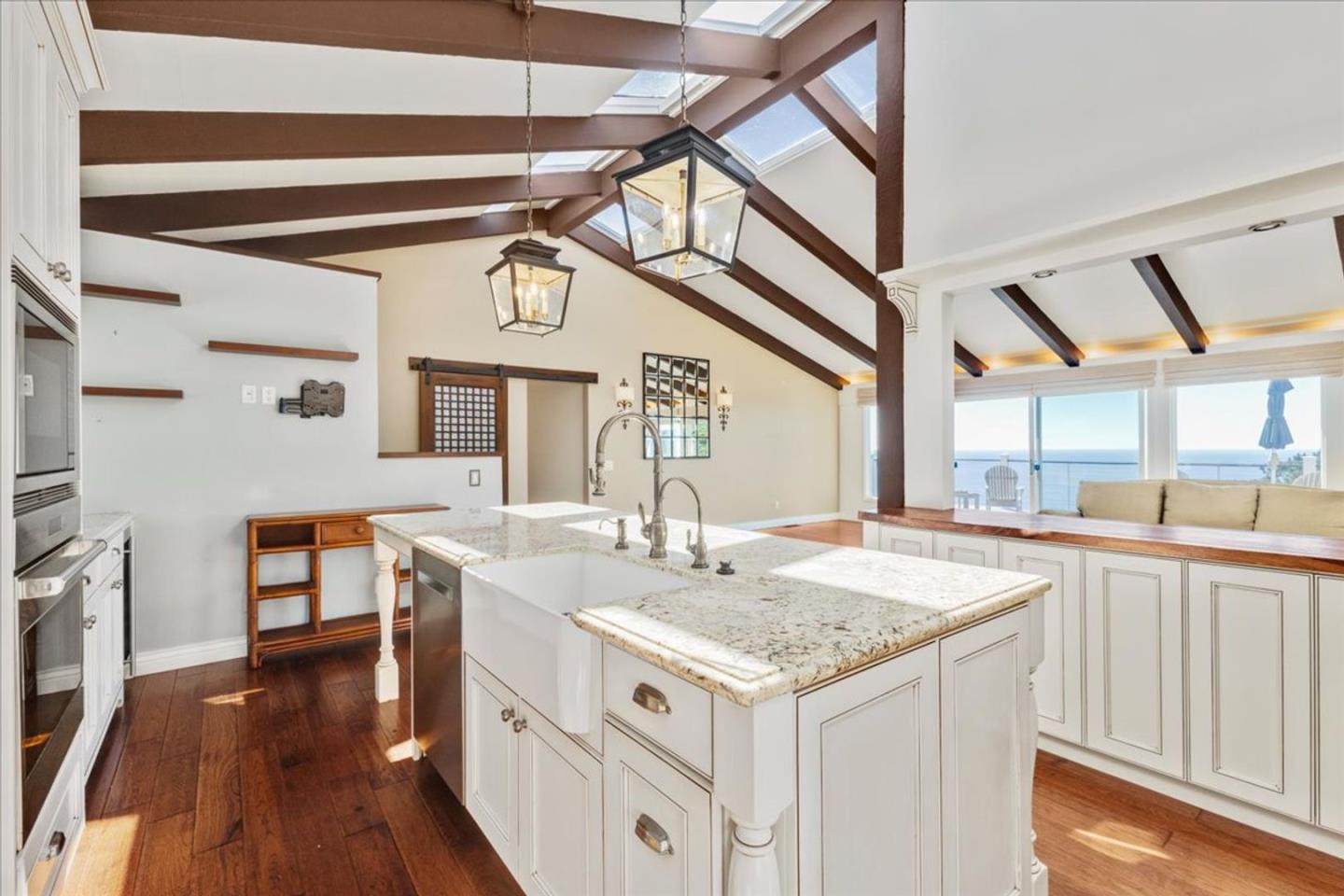 15 Mentone Road Carmel, CA 93923 - Photo 7 of 47 a view of a kitchen area with furniture and wooden floor