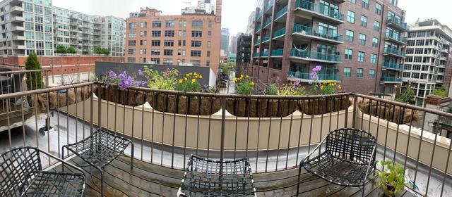 14 North Sangamon Street, Unit 403 Chicago, IL 60607 - Photo 15 of 16 a view of balcony with wooden floor