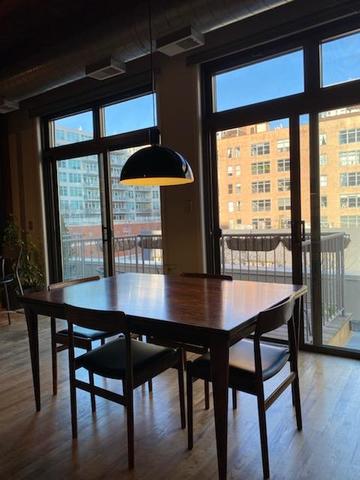 14 North Sangamon Street, Unit 403 Chicago, IL 60607 - Photo 3 of 16 a view of a dining room with furniture and window
