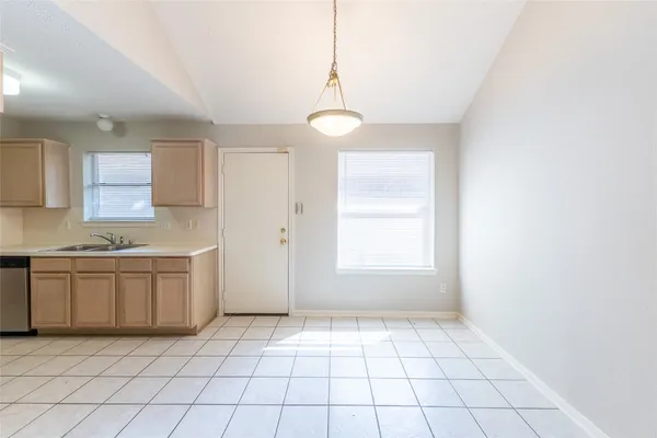 a view of a kitchen with a sink and a window