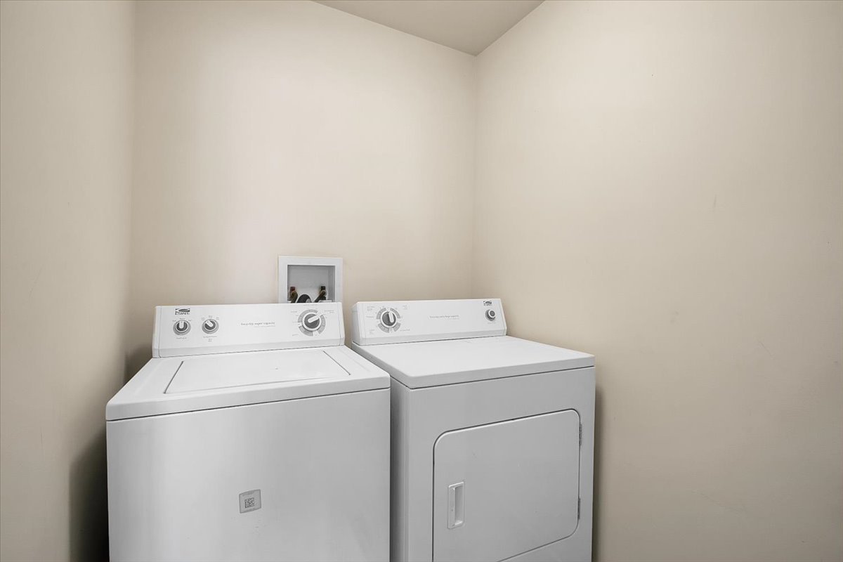 4932 Montauk Drive, Unit 4932 Plainfield, IL 60586 - Photo 16 of 23 a utility room with dryer and washer